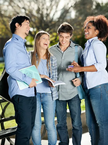 Happy Students Standing In Campus