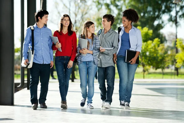 College Students Walking Together On Campus