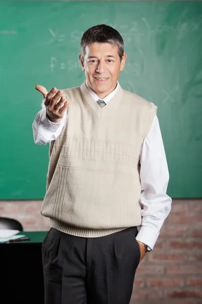 Confident Professor Gesturing In Classroom