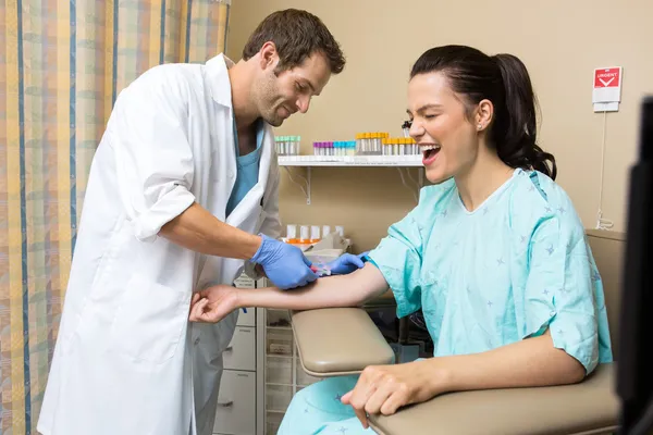 Patient Screaming While Doctor Drawing Blood Sample