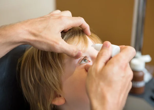 Optometrist Hands Putting Eye Drops In Patients Eye