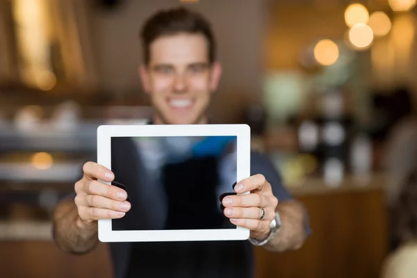 Cafe Owner Showing Digital Tablet