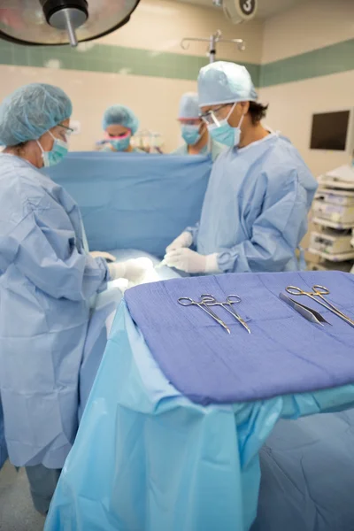 Surgeons Operating in Surgical Theater