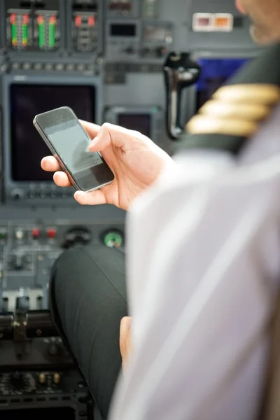 Pilots Using Smartphone In Cockpit