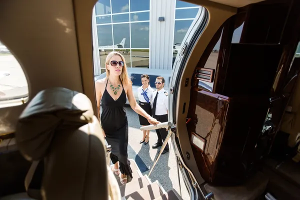 Beautiful Woman In Dress Boarding Private Plane