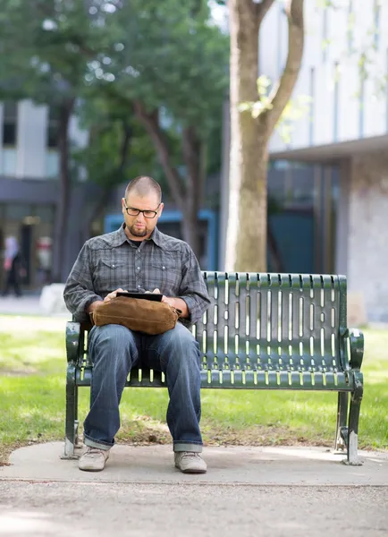 University Student Using Digital Tablet On Campus