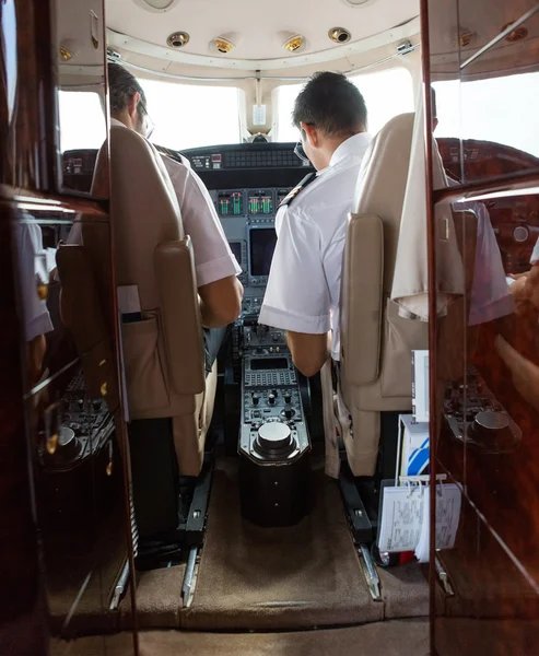 Pilot And Copilot Operating Private Jet