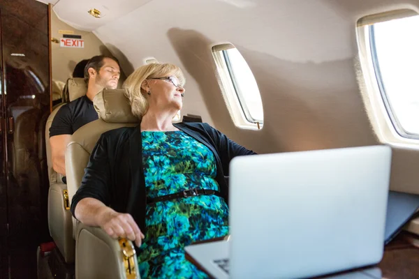 Business People Sleeping On Plane