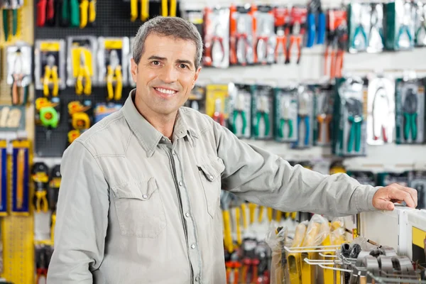 Man Standing In Hardware Store