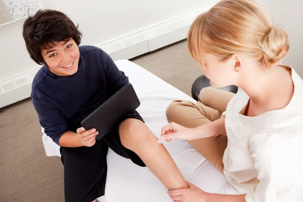 Child with Digital Tablet During Acupuncture