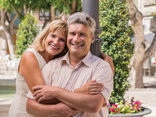 Romantic smiling mature healthy romantic middle-aged couple