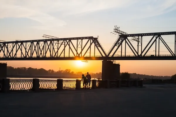 Walk at the river at sunset