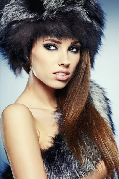 Fur Fashion. Beautiful Girl in Fur Hat. Winter Woman Portrait