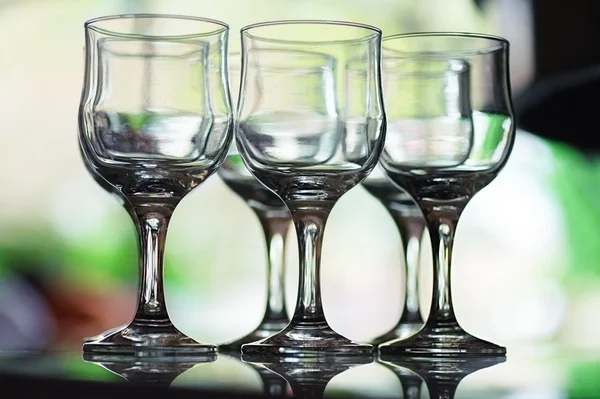 Six empty crystal wine glasses