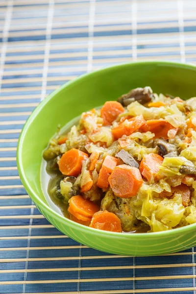 Fries with meat, cabbage and carrots