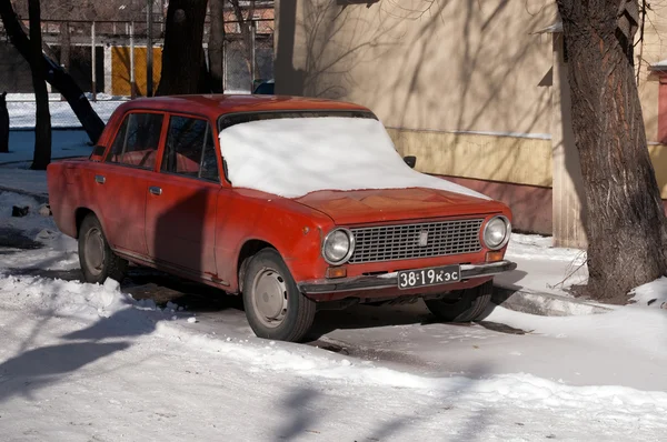 Old car with old registration number in Abakan