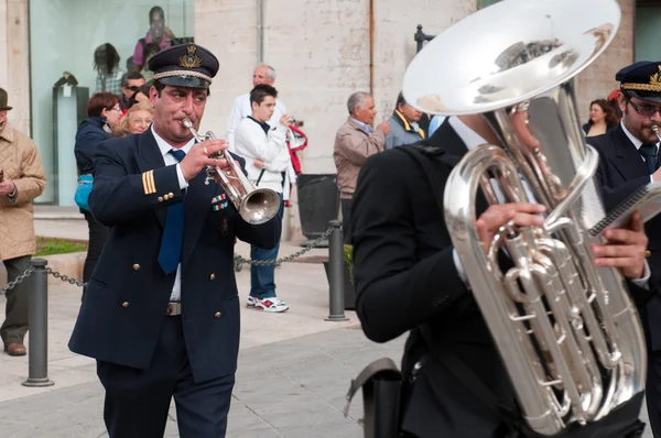 Street musicians play a music.