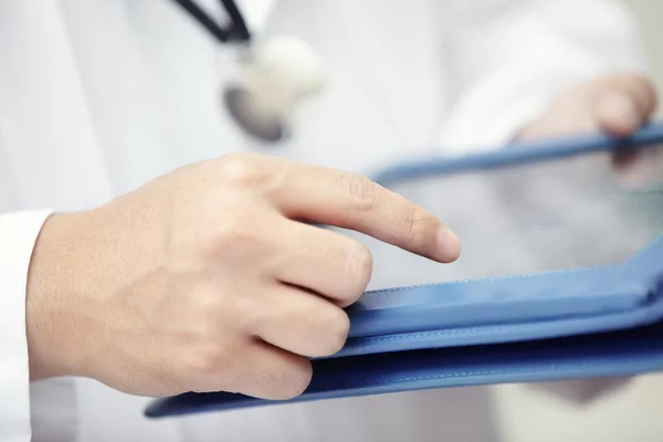 Doctor with tablet computer