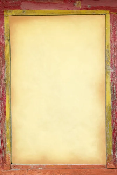 Yellow old paper in the old frame