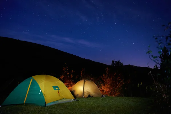 Illuminated yellow camping tent