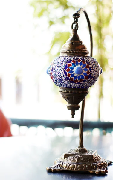 Closeup of mosaic lamp in arabic style