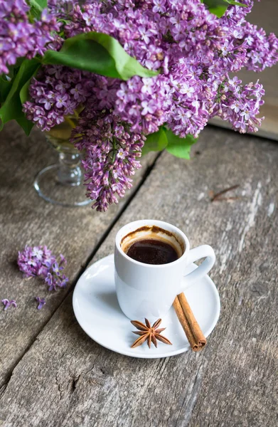 Lilac flowers and coffee