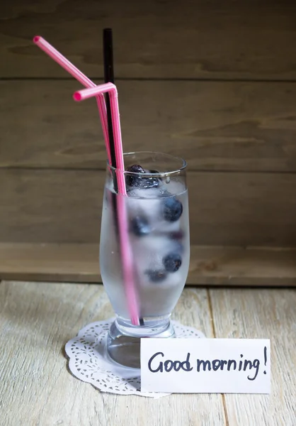 Blueberry juice with ice and flowers