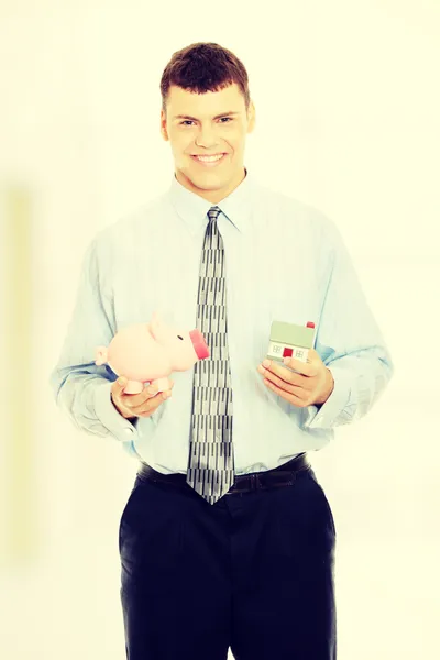 Business man with piggy bank