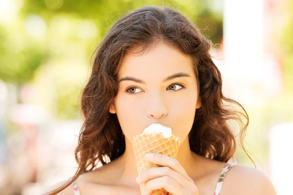 Happy woman eating ice-cream