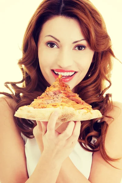 Happy woman eating pizza.