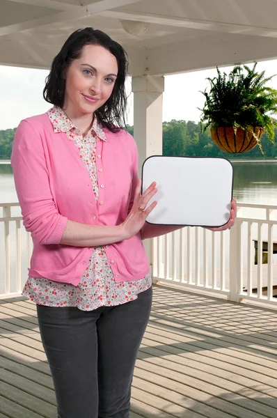 Woman Holding a Blank Sign