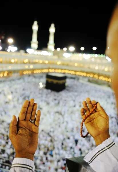 Muslim praying at Mekkah with hands up