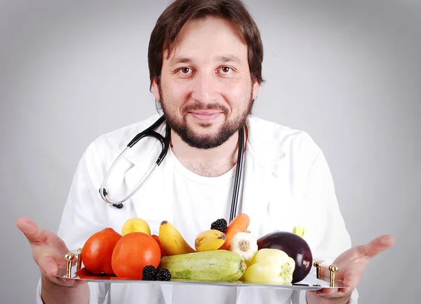 Young male doctor advising healthy natural food