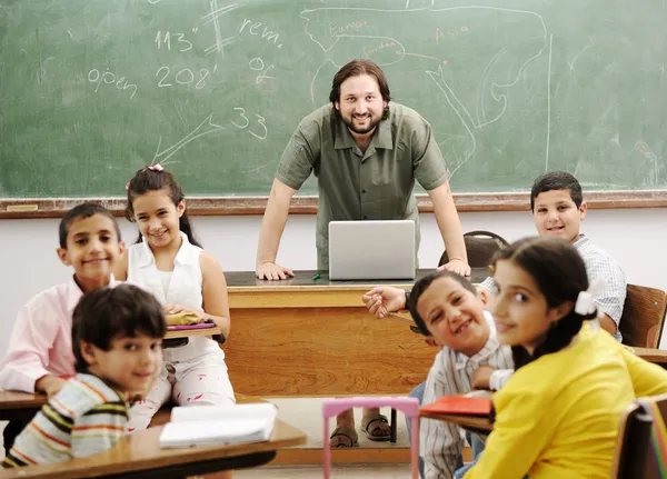 Teacher with children in classroom