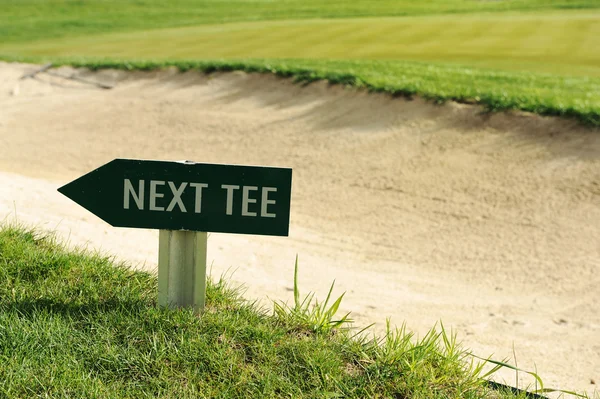 Next tee sign arrow direction golf field