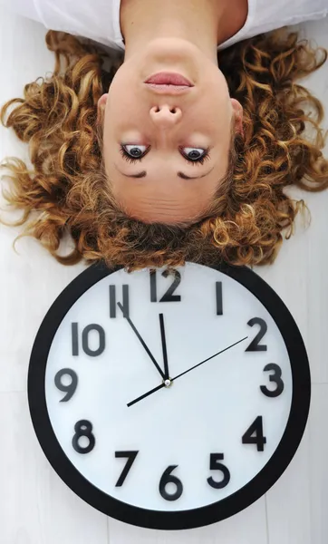 Girl and clock upside down