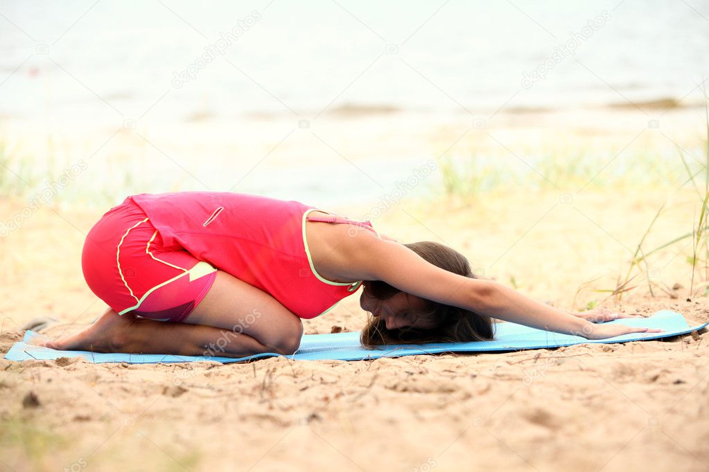 Woman Doing Yoga Exercises On The Seaside Stock Photo Yekophotostudio