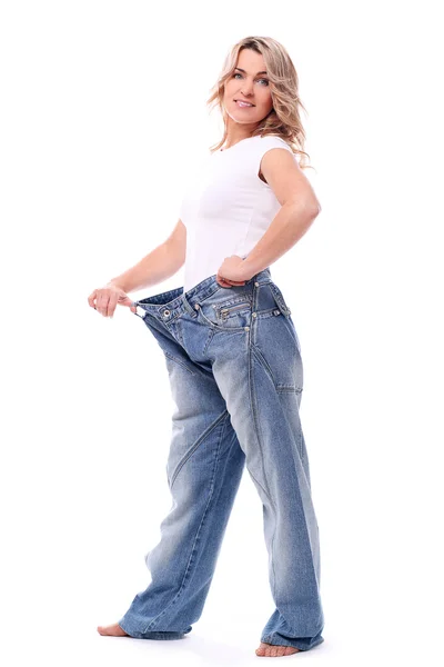 Mid aged woman in big pants after weight losing