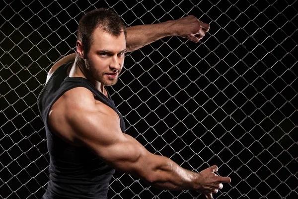 Strong man and his muscles — Stock Photo #39744619