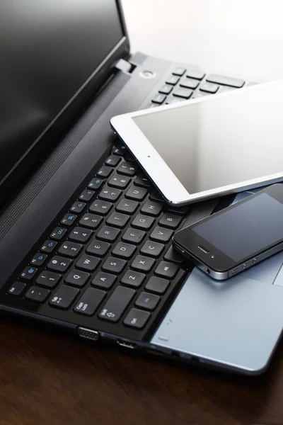 Laptop, mobile and tablet on table