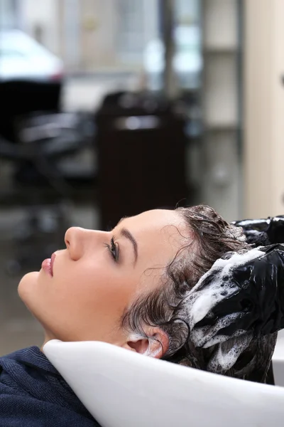 Woman during hair wash