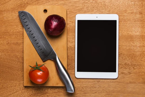 Knife and tablet on the table