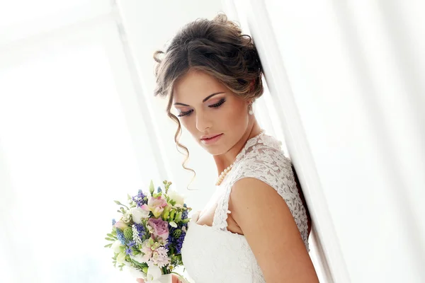 Beautiful bride with bouquet