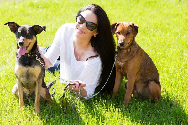 Attractive girl with beautiful dogs