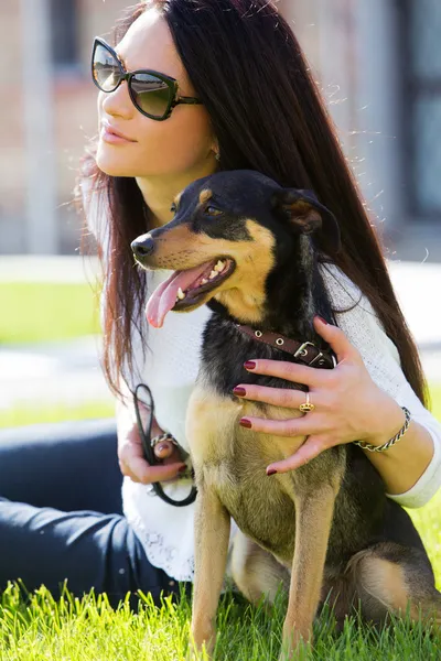 Attractive girl with beautiful dog