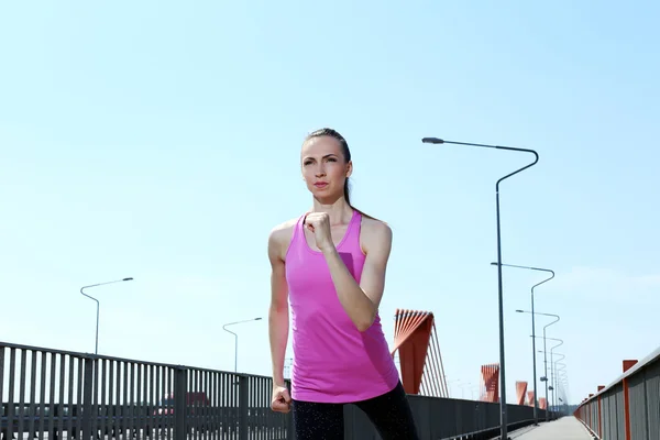 Woman running on the street