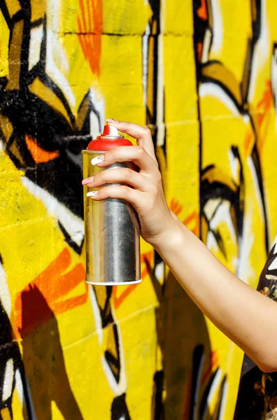 Girl holding spray can