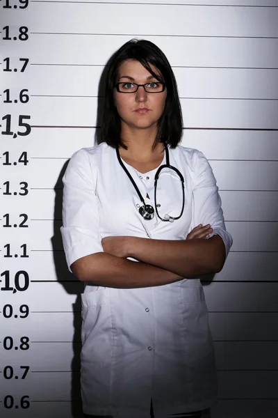Doctor over jail background