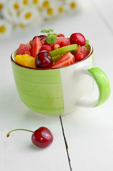 Green cup with fruit