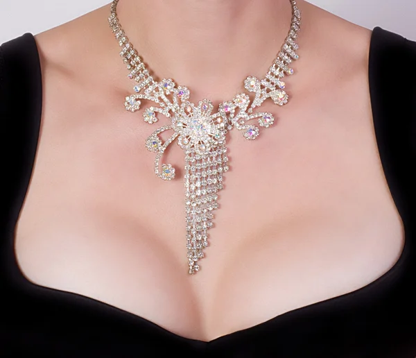 Woman breast with jewelry